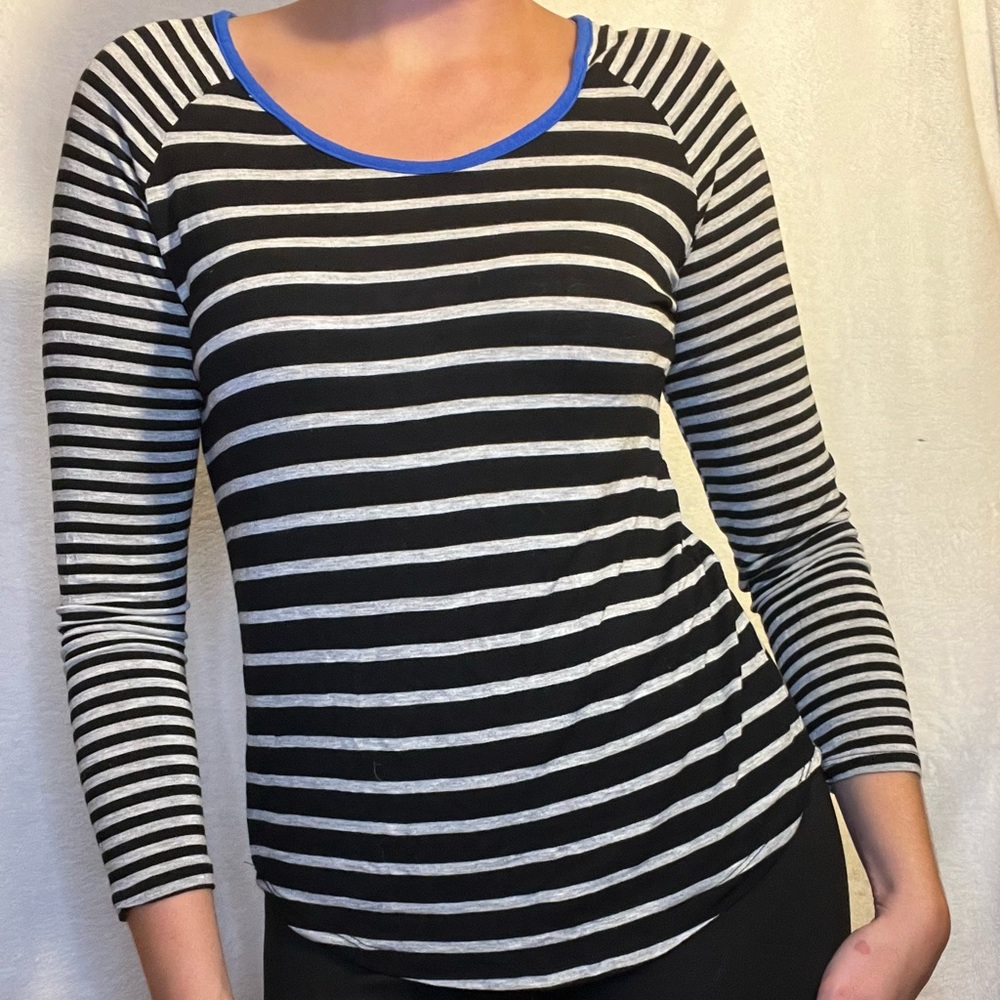 Black and white striped shirt with blue collar